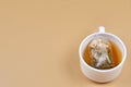 Green tea bag with hot water in a cup Royalty Free Stock Photo