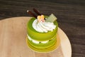 Green tea cake placed on a wooden plate Royalty Free Stock Photo