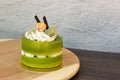 Green tea cake placed on a wooden plate Royalty Free Stock Photo