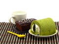 Green tea cake rolls and sweet brownies chocolate cakes Royalty Free Stock Photo