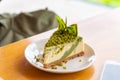 Green tea cheese cake on white dish Royalty Free Stock Photo