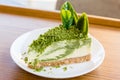 Green tea cheese cake on white dish Royalty Free Stock Photo