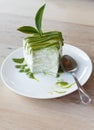 Green tea crepe cake on white disk