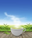 Green tea cup on wooden floor background