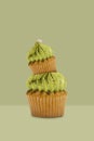 Green tea cupcake on green background, idea minimal concept for new year and christmas holliday Royalty Free Stock Photo