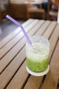 Green tea drink of cold milk on table. Royalty Free Stock Photo