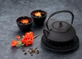 green tea and flowers. Black iron asian style teapot and cups Royalty Free Stock Photo