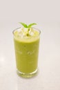 Green tea frappe, topping with peppermint leaf. Royalty Free Stock Photo