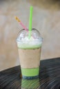 Green tea Frappuccino with whip cream on top and one piece strawberry bread. Royalty Free Stock Photo