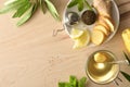Green tea with ginger and root sliced on dish top Royalty Free Stock Photo