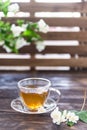 Green tea in glass cup with jasmine flowers on wooden background. Copy space Royalty Free Stock Photo