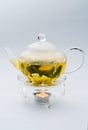 Green tea in glass teapot Royalty Free Stock Photo