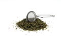 Green tea with herbs in sieve on a White Background Royalty Free Stock Photo