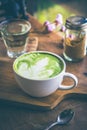 Green tea hot drink latte white cup on wood table aroma relax ti Royalty Free Stock Photo