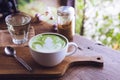 Green tea hot drink latte white cup on wood table aroma relax ti