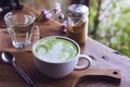 Green tea hot drink latte white cup on wood table aroma relax ti Royalty Free Stock Photo