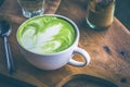 Green tea hot drink latte white cup on wood table aroma relax ti Royalty Free Stock Photo
