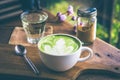 Green tea hot drink latte white cup on wood table aroma relax ti Royalty Free Stock Photo