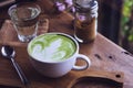 Green tea hot drink latte white cup on wood table aroma relax ti Royalty Free Stock Photo