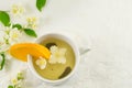 Green tea with jasmine leaf in a cup Royalty Free Stock Photo