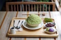 Green tea kakigori Bingsu - A bowl of Japanese shaved ice dessert flavor, served with red bean, mochi and matcha kanten jelly