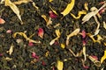 Green tea loose dried tea leaves and sunflower petals. Royalty Free Stock Photo