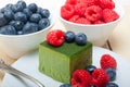 Green tea matcha mousse cake with berries Royalty Free Stock Photo