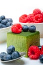 Green tea matcha mousse cake with berries Royalty Free Stock Photo