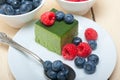 Green tea matcha mousse cake with berries Royalty Free Stock Photo