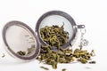 Green tea in a metal strainer. Concept natural tasty healthy drink.