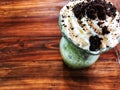 Green tea milkshake mixed chocolate cookie and whipped cream on top