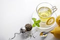 Green tea with mint and lemon with strainer top view Royalty Free Stock Photo