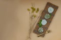 Green tea and Red bean daifuku serve with brass fork on bamboo placemat with orange background