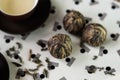 Green tea and small balls bundle of dried green tea leaves Royalty Free Stock Photo