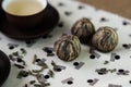 Green tea and small balls bundle of dried green tea leaves Royalty Free Stock Photo
