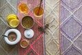 Tea and spices composition on a Peruvian rug.