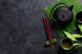 Green tea and sushi chopsticks Royalty Free Stock Photo