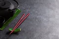 Green tea and sushi chopsticks Royalty Free Stock Photo