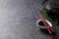 Green tea and sushi chopsticks Royalty Free Stock Photo