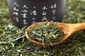 Green tea on wooden spoon Royalty Free Stock Photo