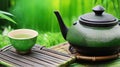 Green Teapot Serenity on Bamboo Mat: A Perfect Harmony for Your Tea Ritual.