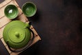 Green teapot and tea cups Royalty Free Stock Photo