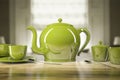 Green teapot and teacups Royalty Free Stock Photo