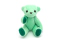 Green teddy bear sitting on white background Royalty Free Stock Photo