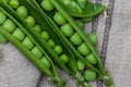 Green, tender, fresh and raw peas. Close-up and top view. Rustic appearance