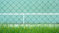 Green tennis court and wall for practice. Royalty Free Stock Photo