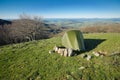 Green tent on the hill in spring landscape