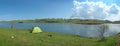 Green tent by the Biviere Lake in Nebrodi Park, Sicily