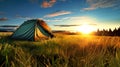 Green Tent on Lush Green Field. Hiking and outdoor recreation