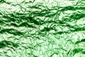 Green texture of crumpled sheet of aluminum foil. Foil background. Royalty Free Stock Photo